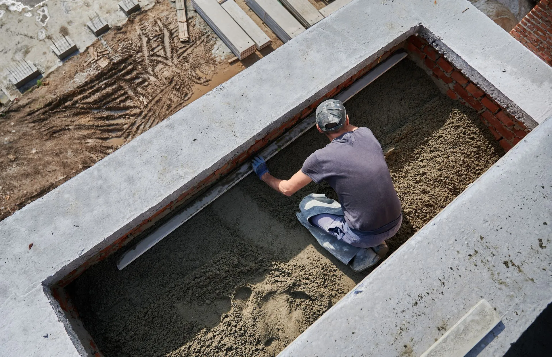 Concrete worker finishing a poured slab
